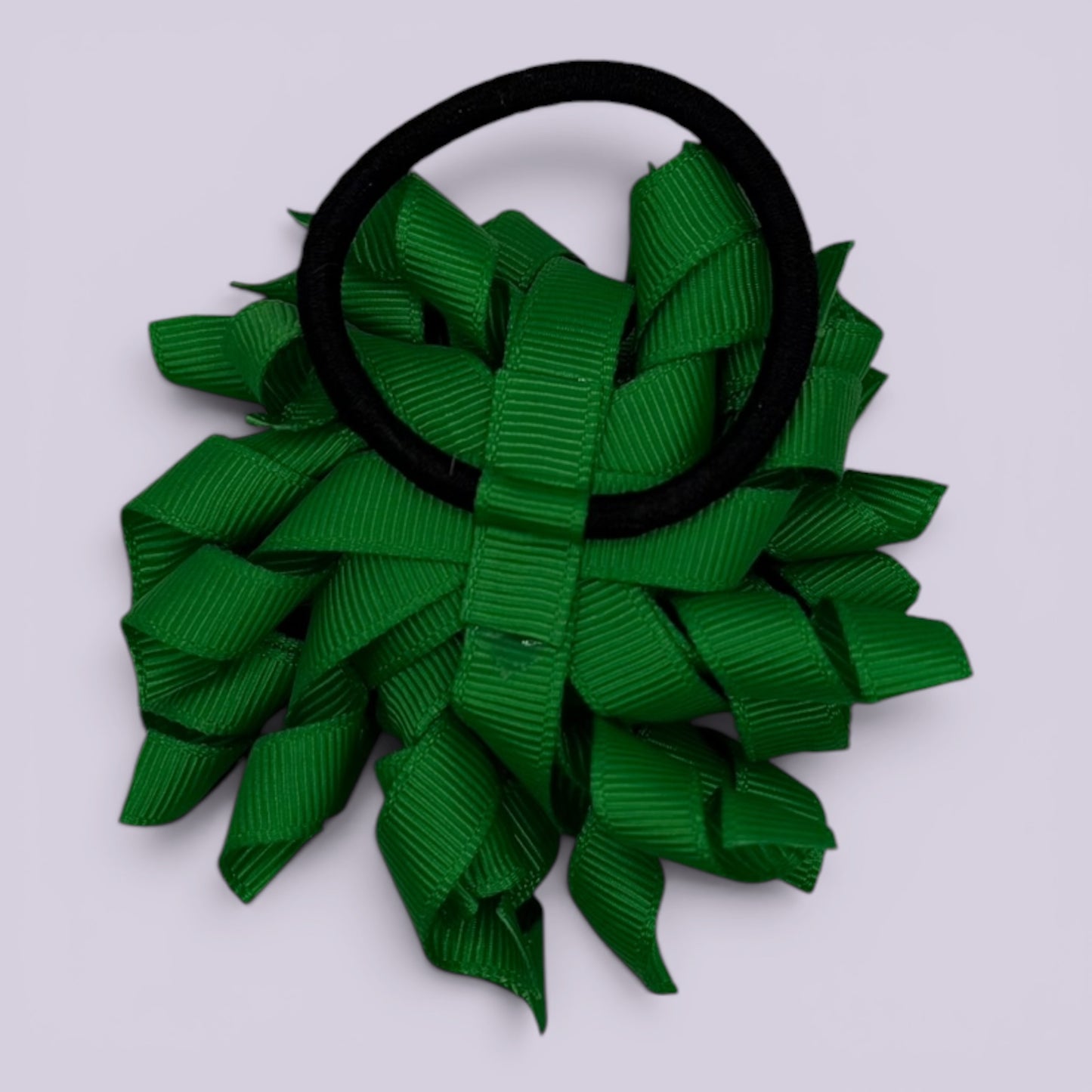 Emerald green korker bow bobble on card
