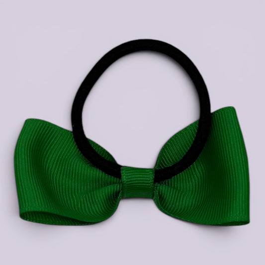 Emerald green bow bobble on card