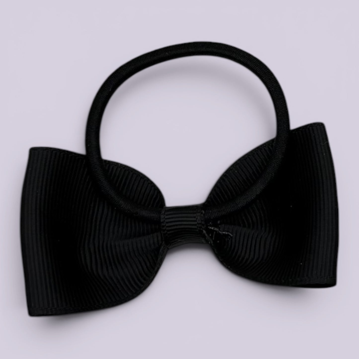Black bowtie bow bobble on card