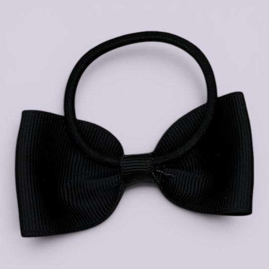 Black bowtie bow bobble on card