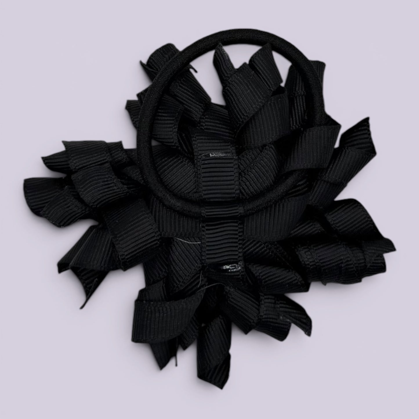Black korker bow bobble on card