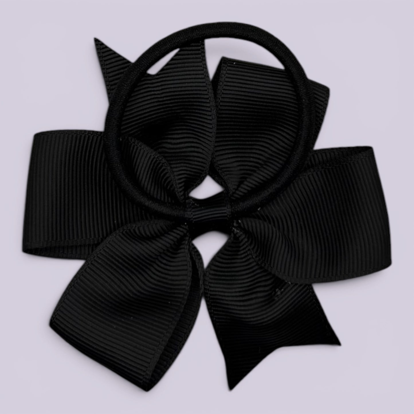 Black pinwheel bow bobble on card