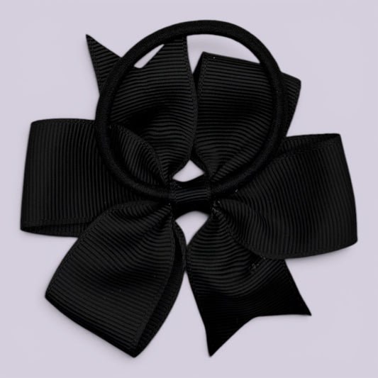 Black pinwheel bow bobble on card