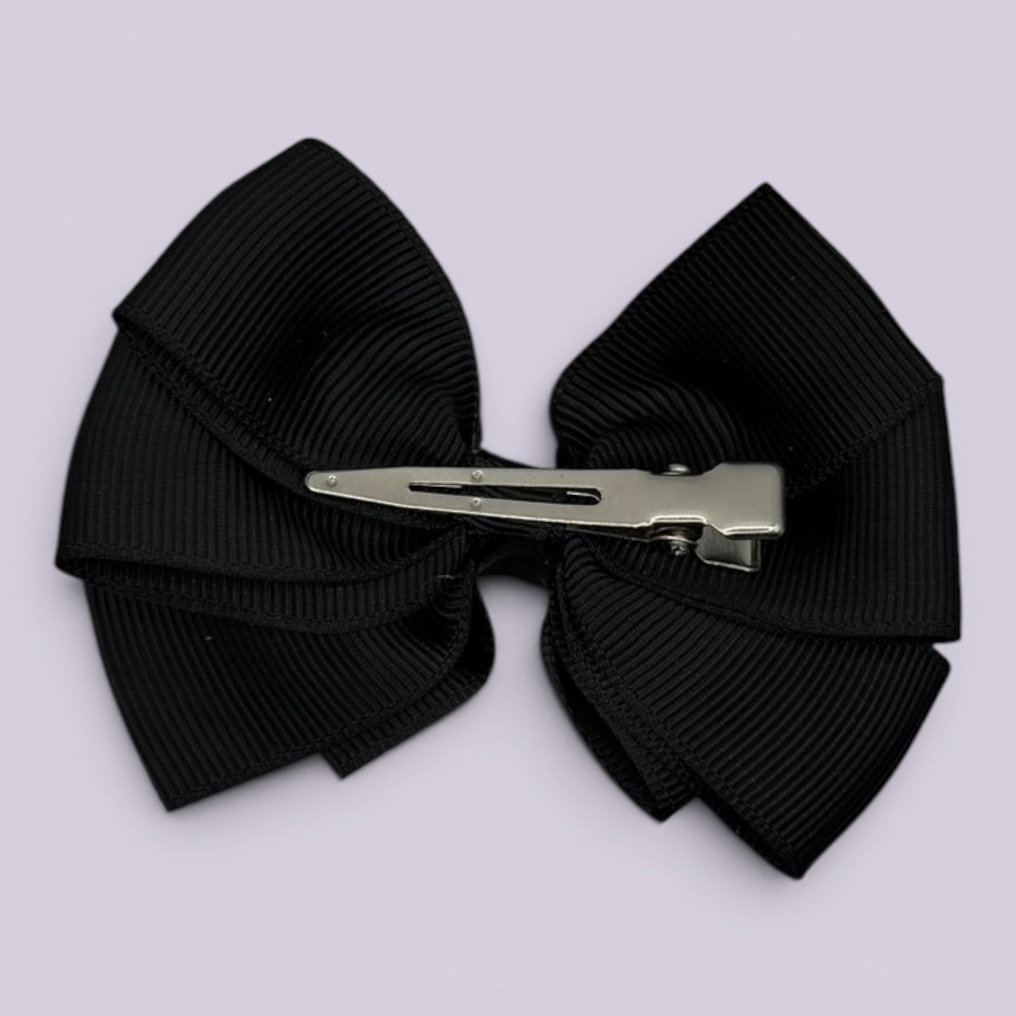 Black pinwheel bow clip on card