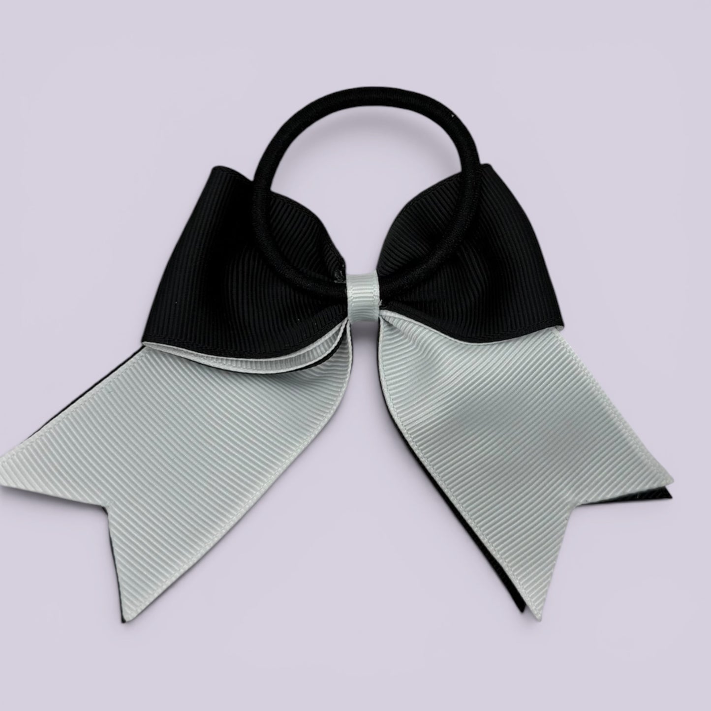 Black and white bow bobble on card