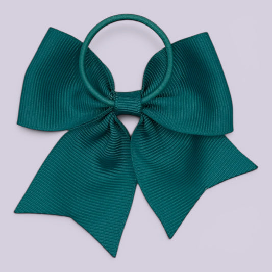 Jade green four tailed bow bobble on card