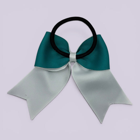 Jade green and white bow bobble on card
