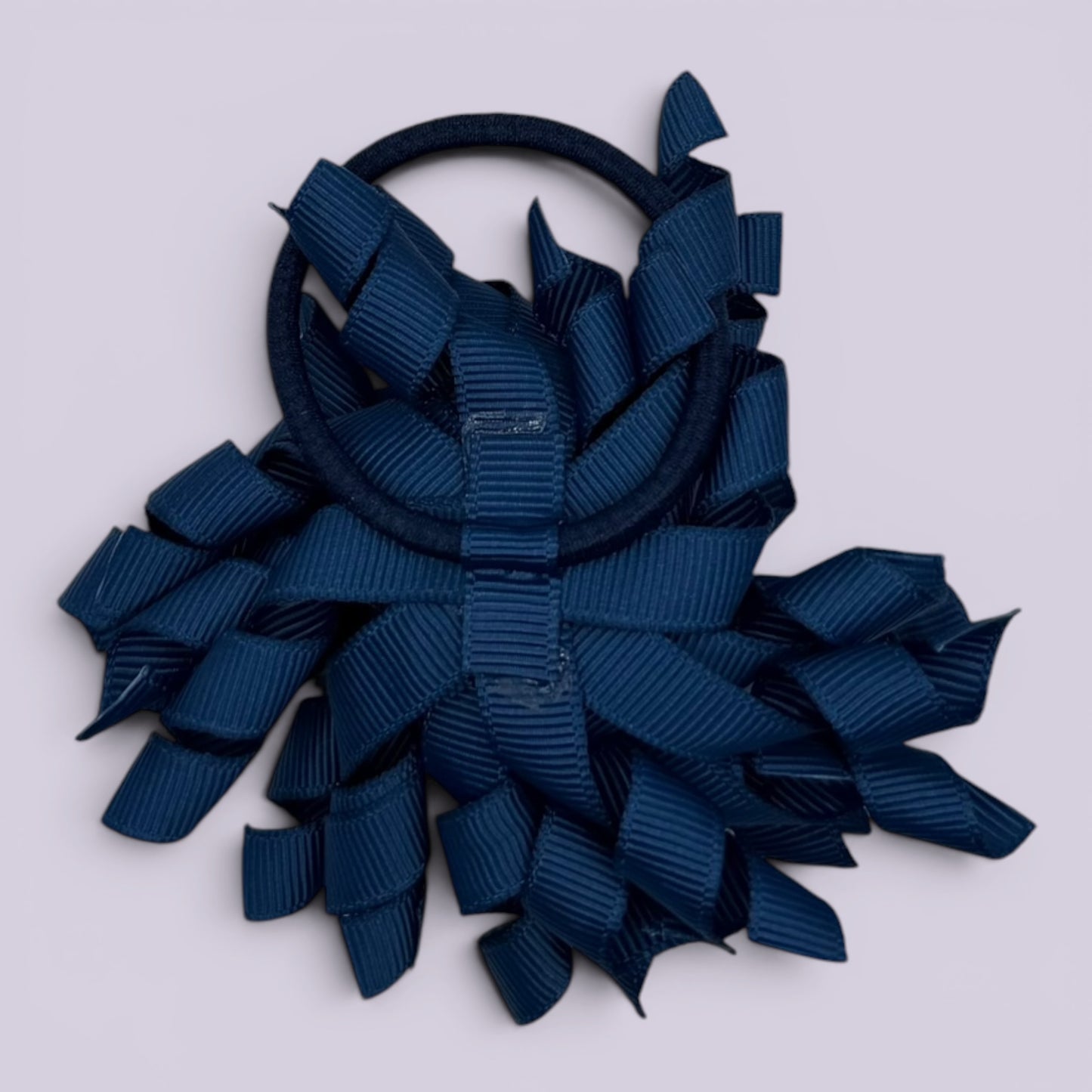 Navy blue korker bow bobble on card