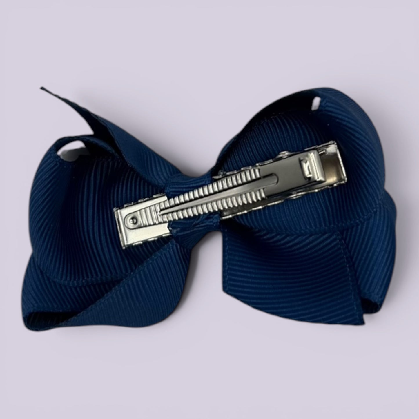 Navy blue small bow clip on card