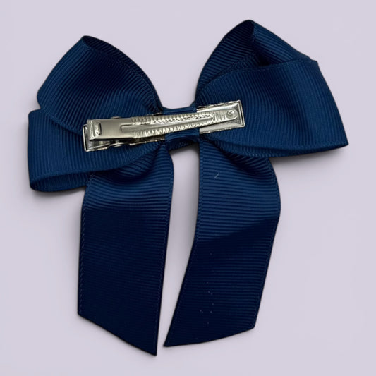 Navy blue tailed bow clip on card