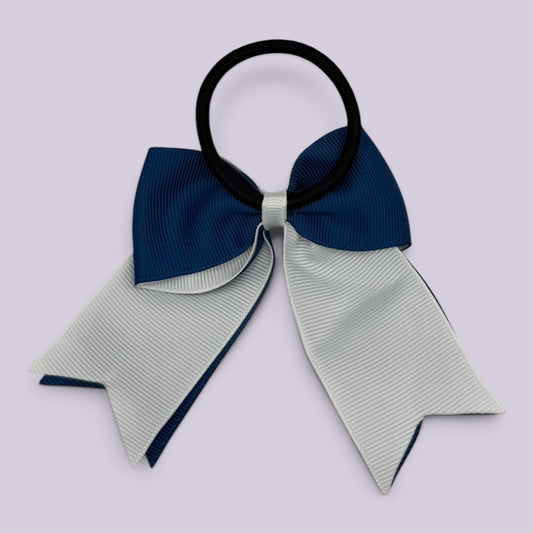 Navy blue and white bow bobble on card