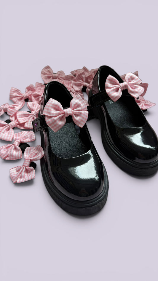 Pink gingham shoe bows on school shoes