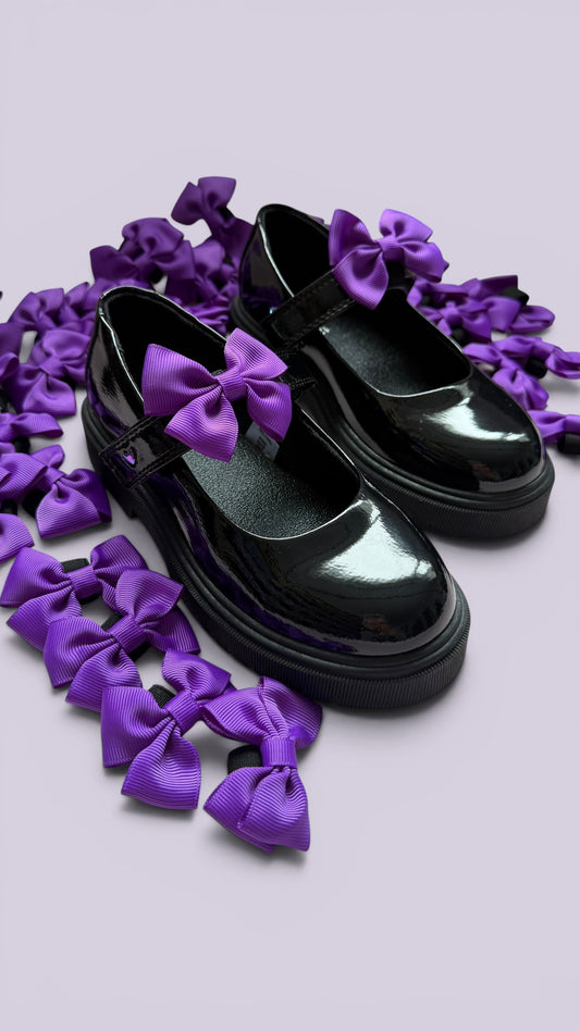 Purple shoe bows on school shoes