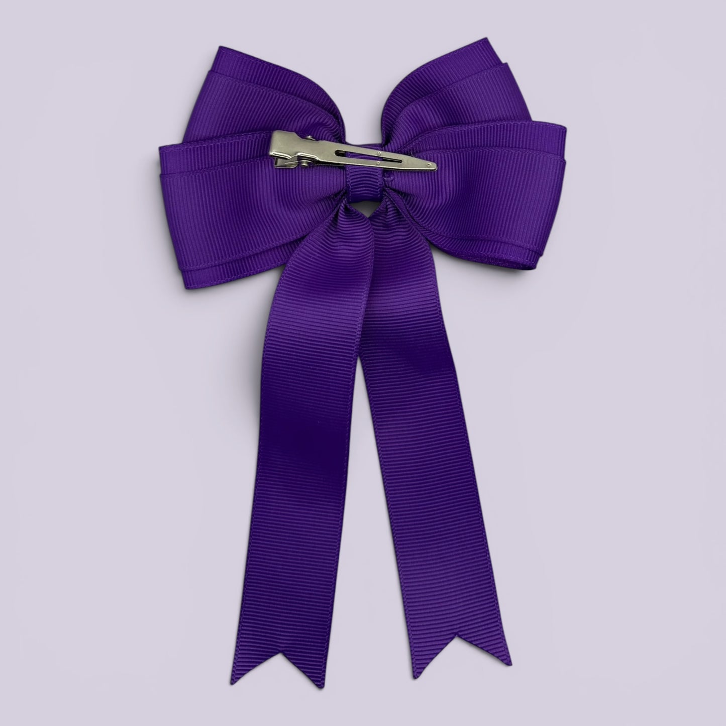 Purple tailed bow clip on card