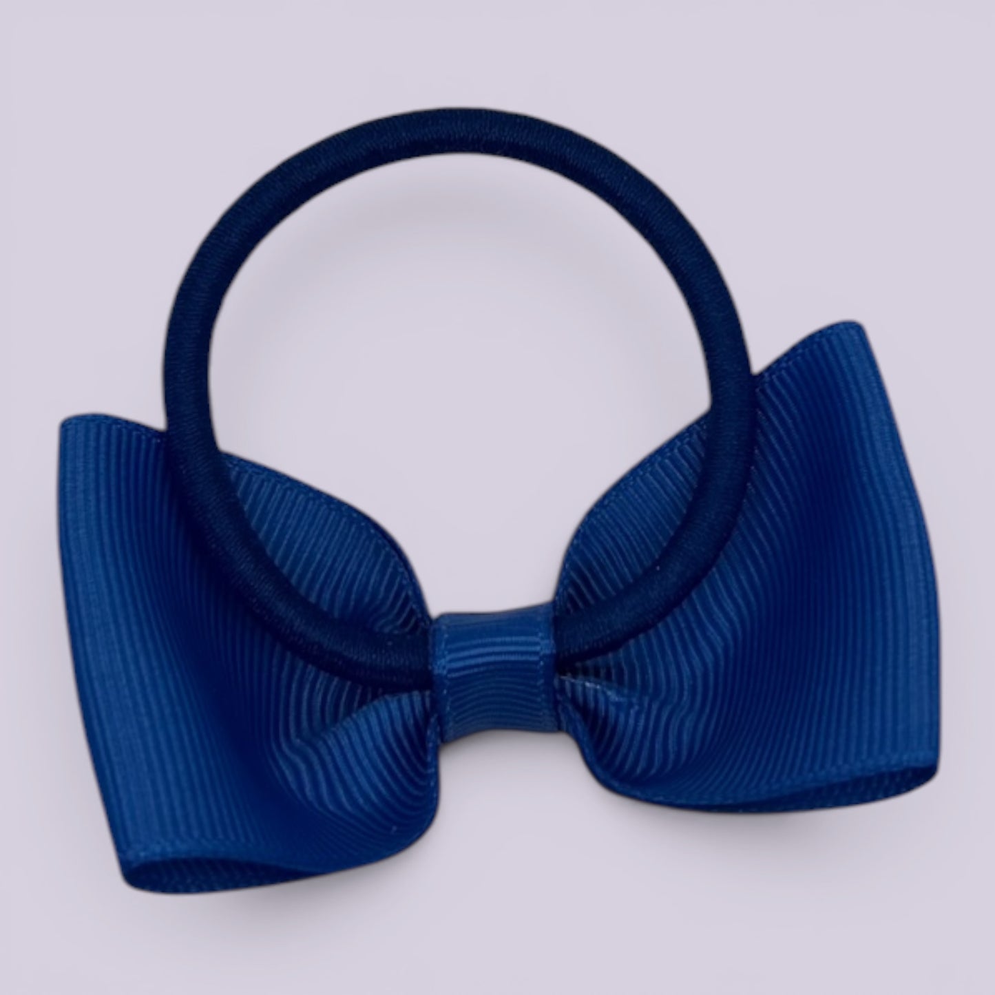 Royal blue bowtie bow bobble on card