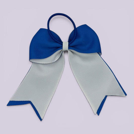 Royal blue and white bow bobble on card