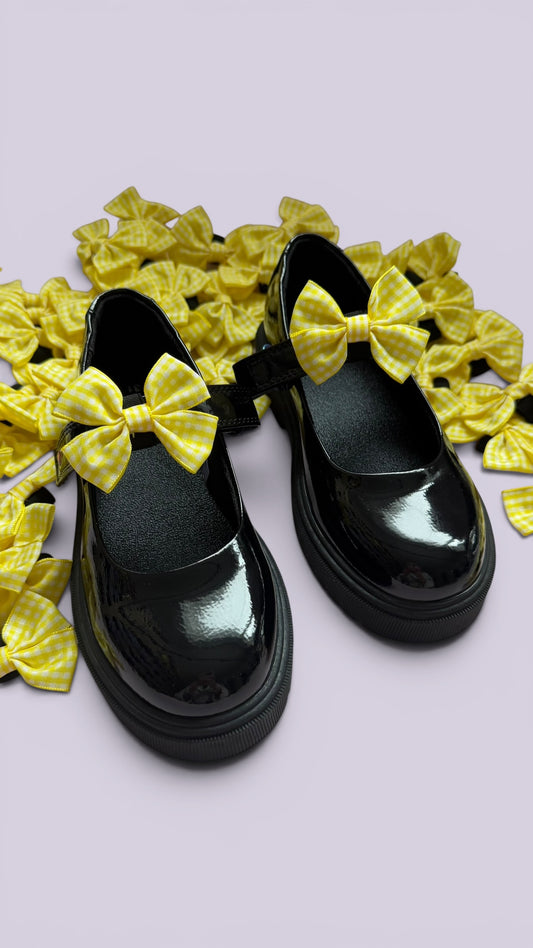 Yellow gingham shoe bows on school shoes