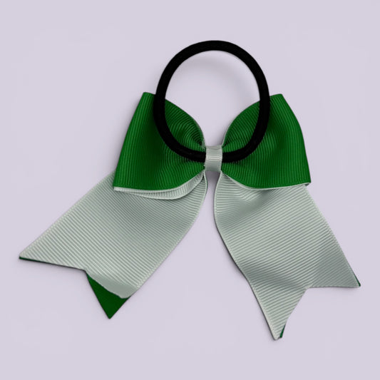 Emerald green and white bow bobble on card