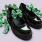 Emerald green gingham shoe bows on school shoes