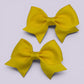 Yellow small school hair bow mini clips pair