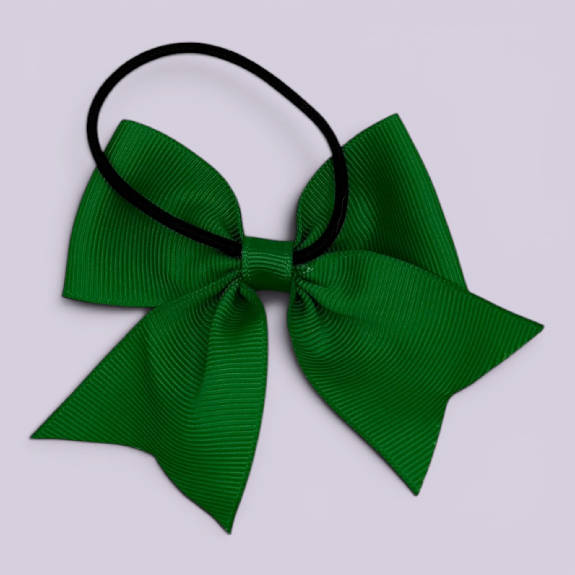 Emerald green four tailed bow bobble on card