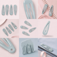Grey school snap hair clips
