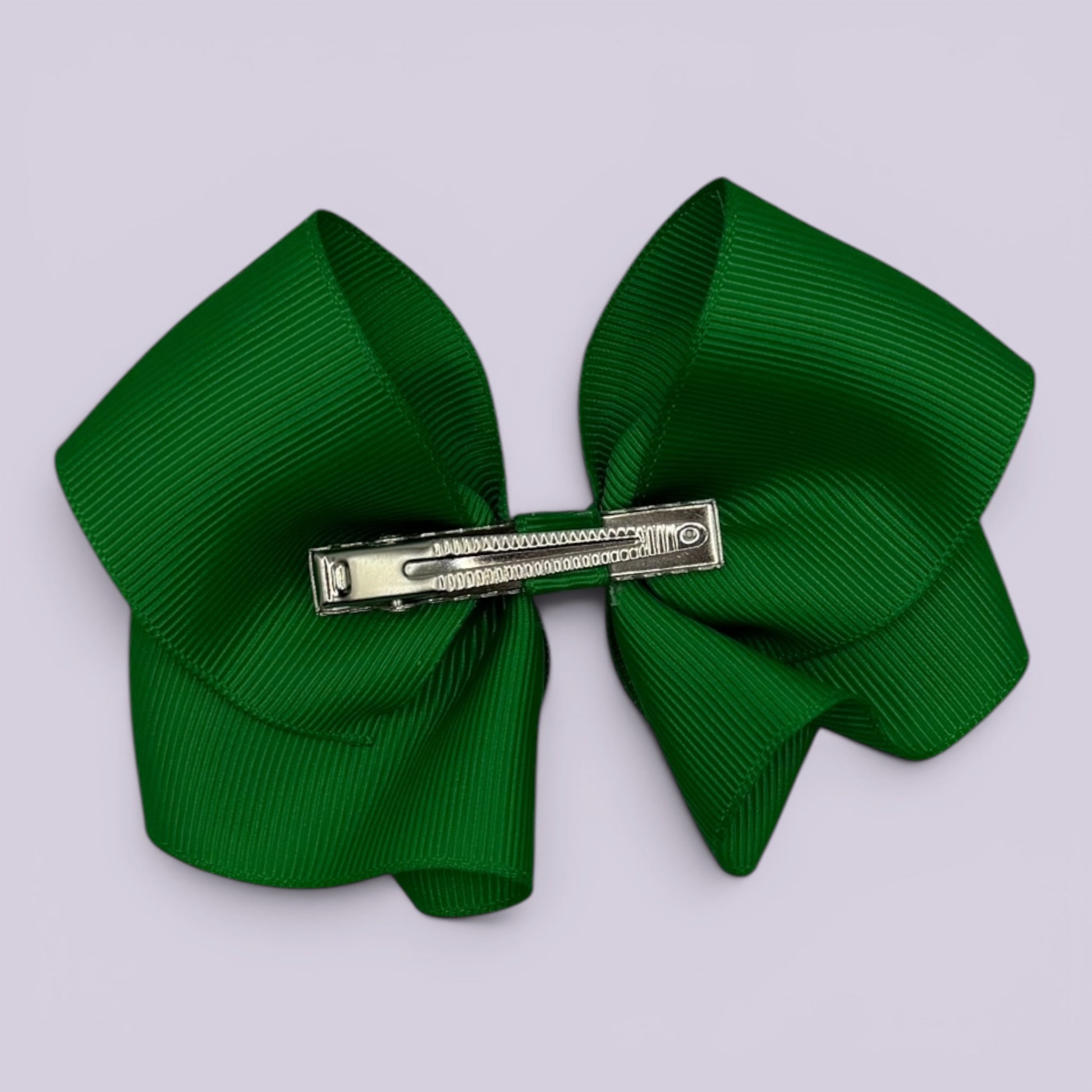 Emerald green bow clip on card