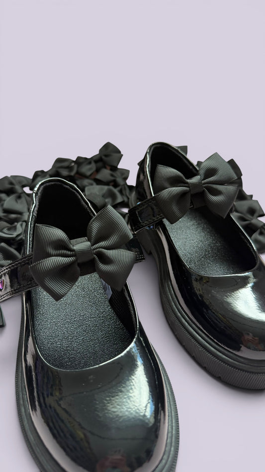 Black shoe bows on school uniform shoes