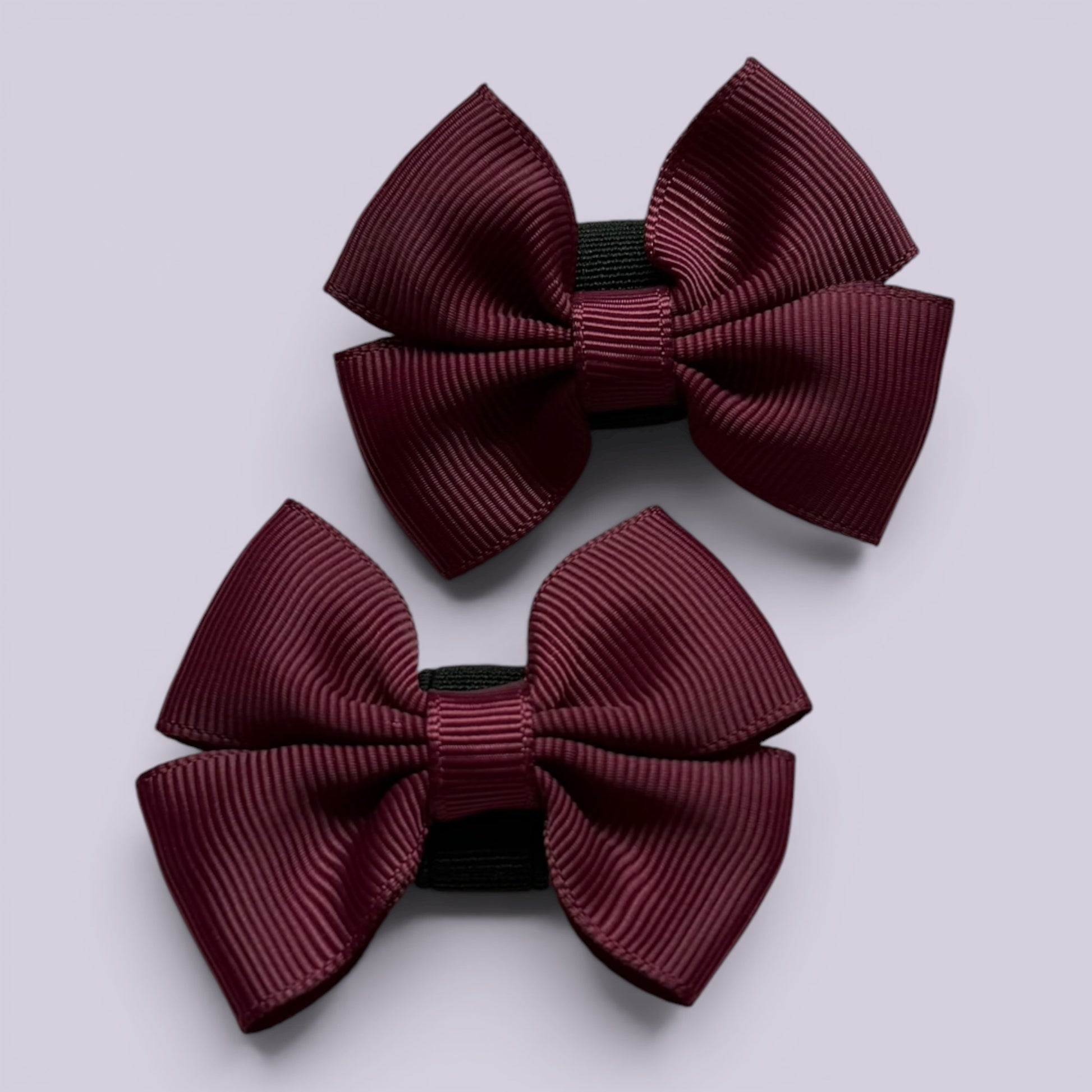 Burgundy maroon shoe bows close up