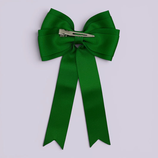Emerald green tailed bow clip on card