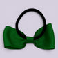 Emerald green bow bobble on card