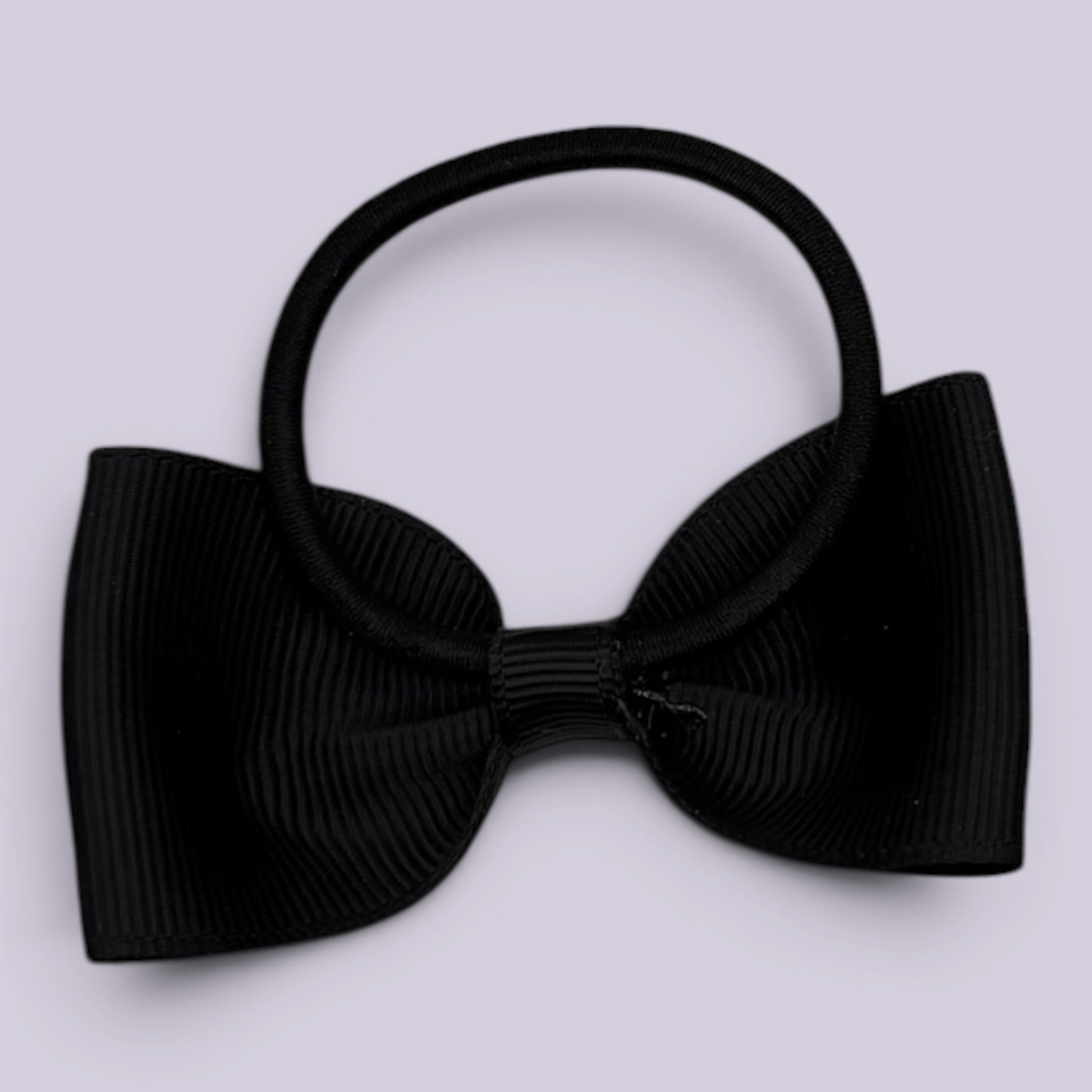 Black bowtie bow bobble on card