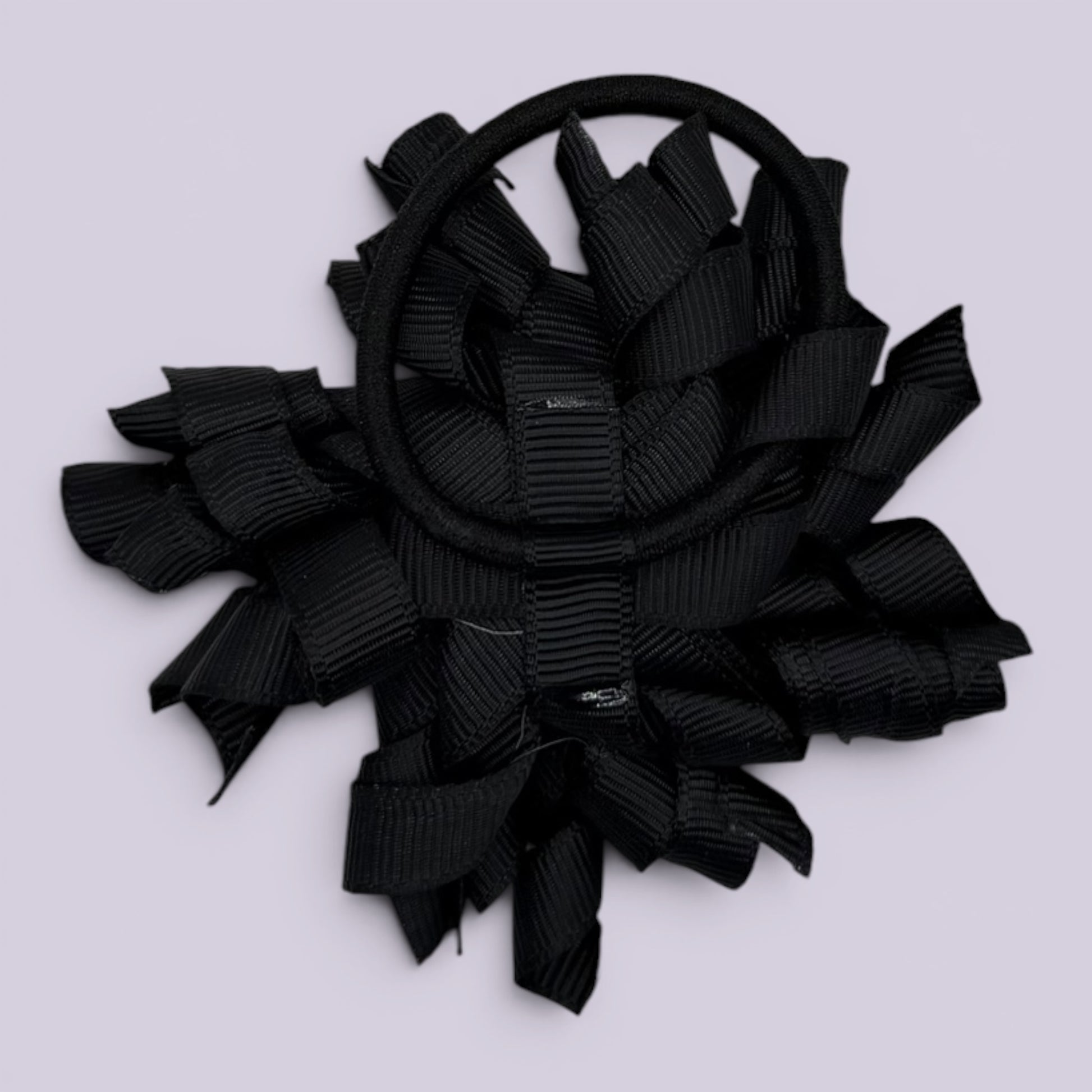 Black korker bow bobble on card