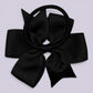 Black pinwheel bow bobble on card