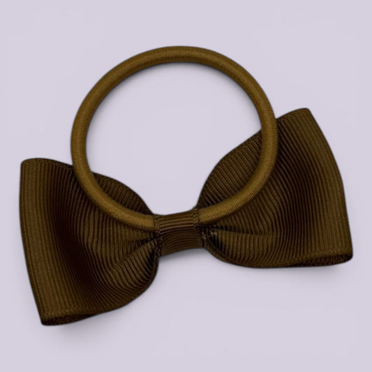 Brown bowtie bow bobble on card