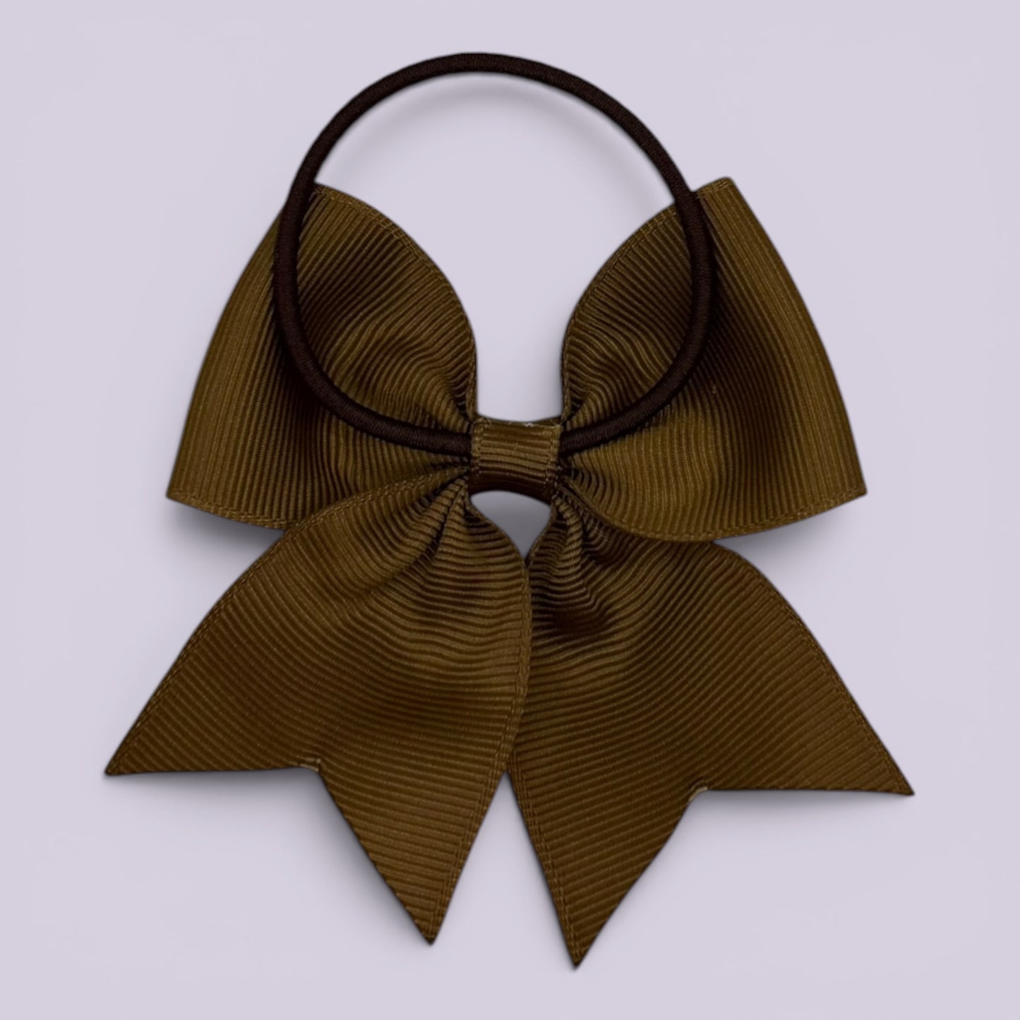 Brown four tailed bow bobble on card