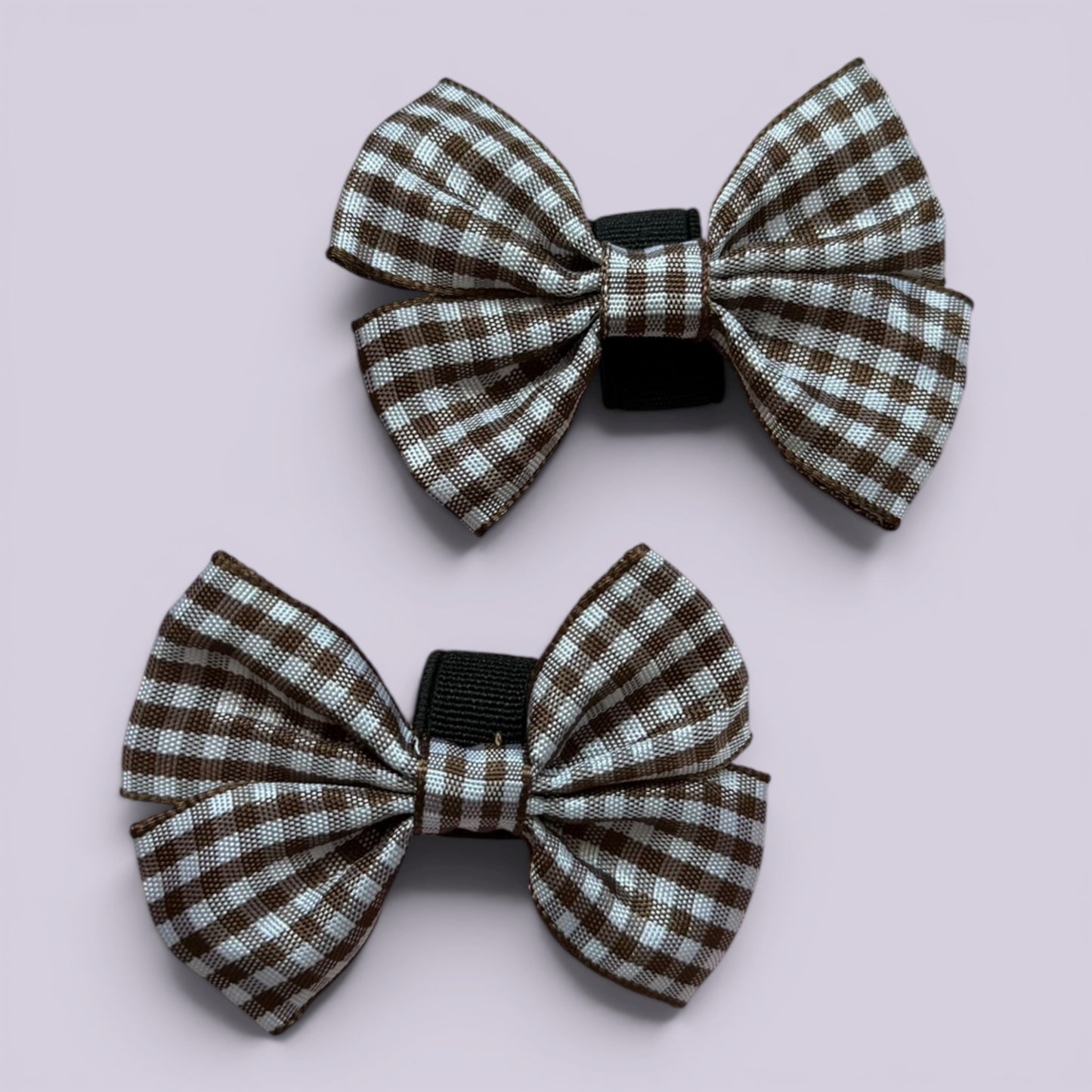 Brown gingham shoe bows close up