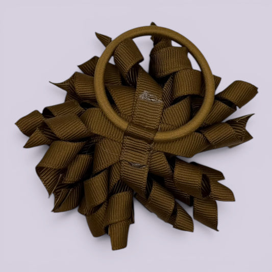 Brown korker bow bobble on card