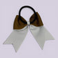 Brown and white bow bobble on card
