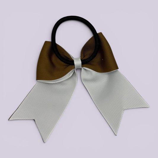Brown and white bow bobble on card