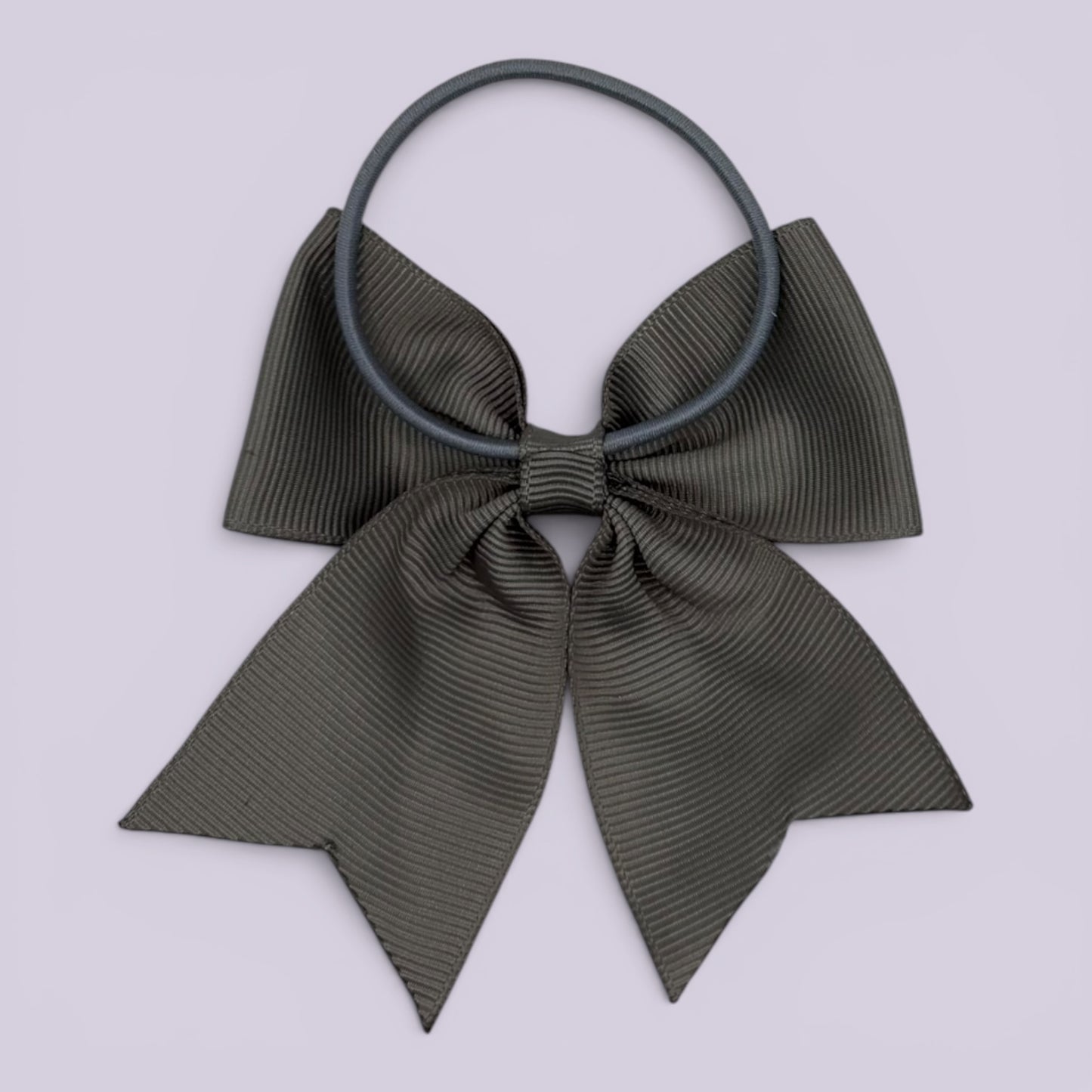 Grey four tailed bow bobble on card