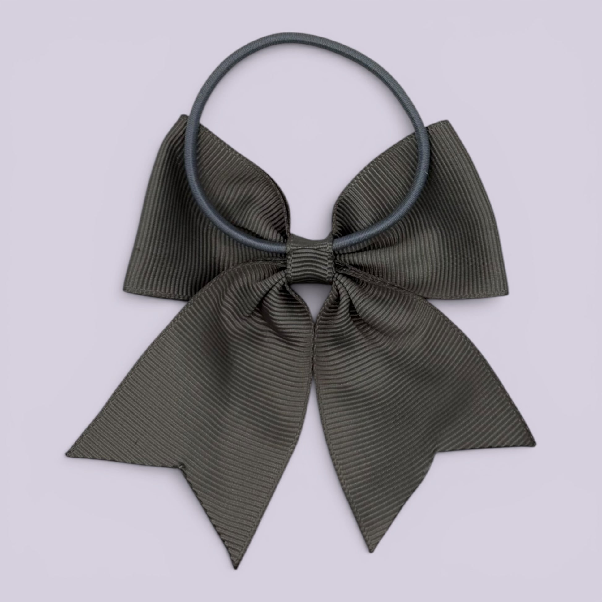 Grey four tailed bow bobble on card
