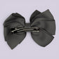Grey pinwheel bow clip on card