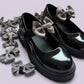 Grey shoe bows on school shoes