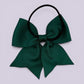 Hunter bottle green four tailed bow bobble on card