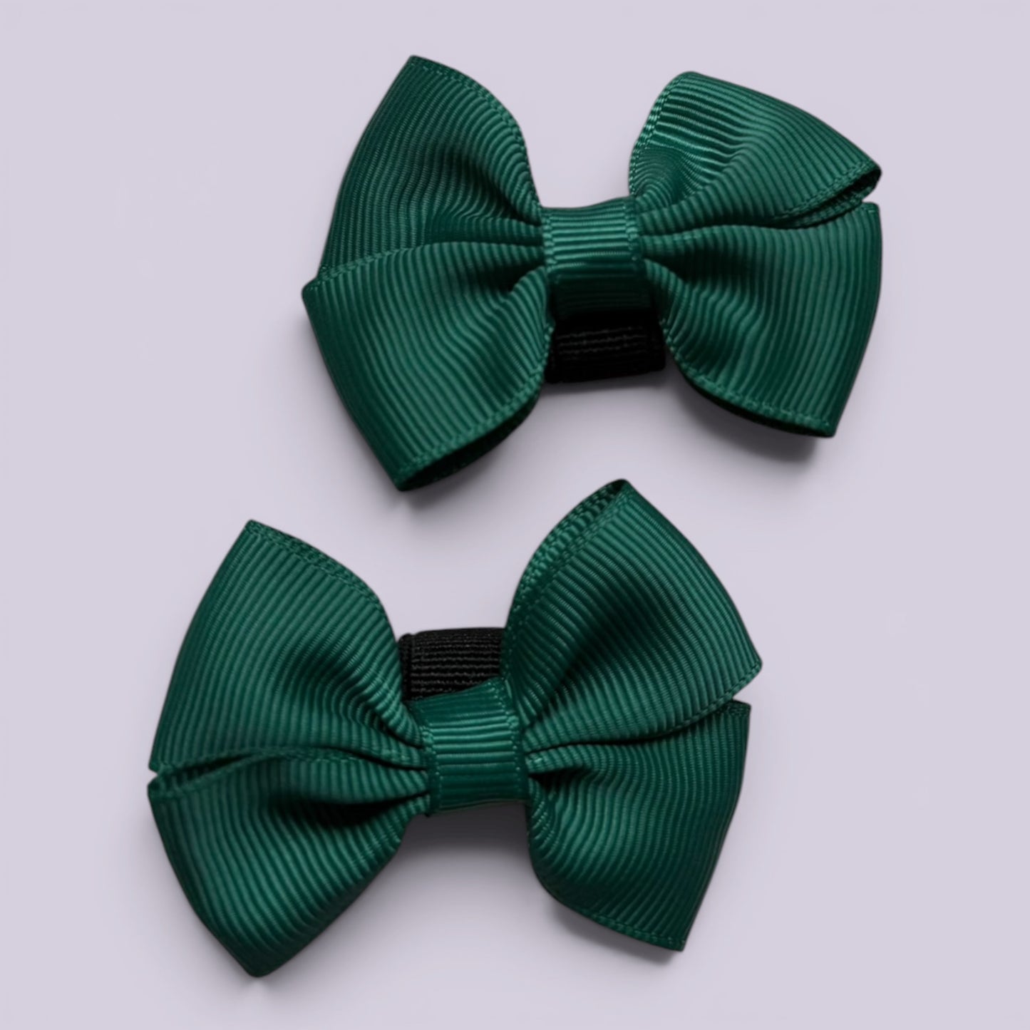 Hunter bottle green shoe bows close up