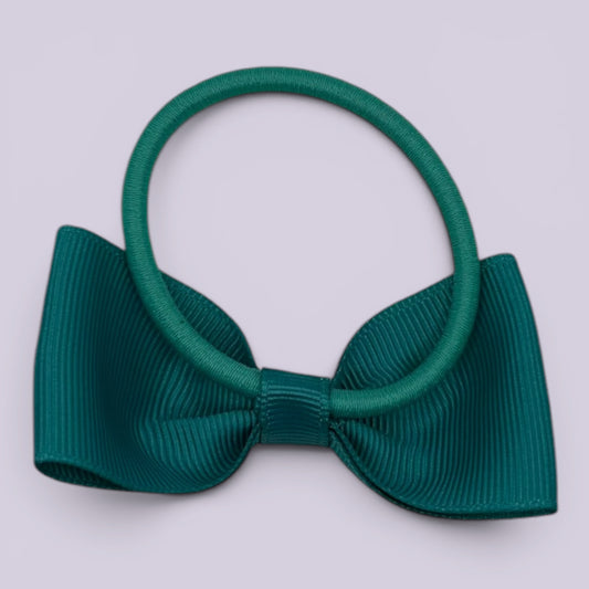 Jade green bowtie bow bobble on card