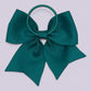 Jade green four tailed bow bobble on card