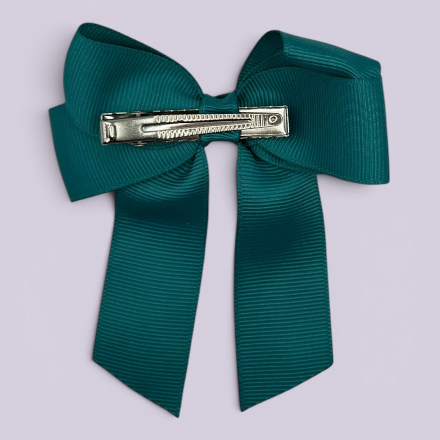 Jade green tailed bow clip on card