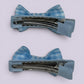 Light blue gingham mini bowtie clips on matching card